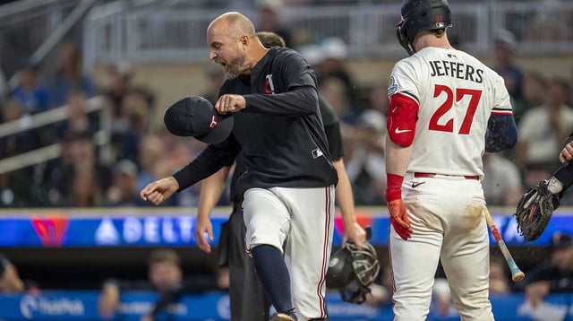 Aug 14, 2025; Minneapolis, Minnesota, USA; Minnesota Twins manager Rocco Baldelli (5) reacts after a strike is called against Minnesota Twins catcher Ryan Jeffers (27) in the eleventh inning at Target Field. Mandatory Credit: Jesse Johnson-Imagn Images.