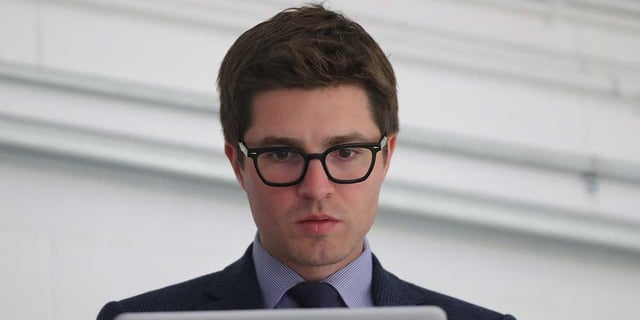 Sep 18, 2018; Lucan, Ontario, CAN; Toronto Maple Leafs general manager Kyle Dubas on his laptop before the start of their game against the Ottawa Senators at Lucan Community Memorial Centre. The Maple Leafs beat the Senators 4-1. Mandatory Credit: Tom Szczerbowski-Imagn Images