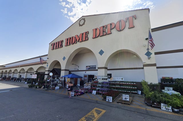 People walk outside a Home Depot in Monrovia, Calif.