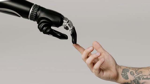AMD CEO Lisa Su believes AI will enhance human work and continues to hire engineers despite technological advancements.