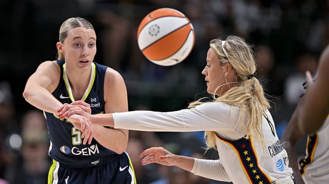 Aug 1, 2025; Dallas, Texas, USA; Dallas Wings guard Paige Bueckers (5) and Indiana Fever guard Sophie Cunningham (8) in action during the game between the Dallas Wings and the Indiana Fever at the American Airlines Center. Mandatory Credit: Jerome Miron-Imagn Images