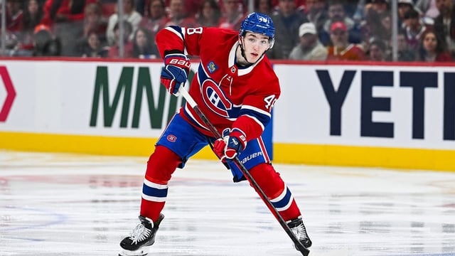 Apr 27, 2025; Montreal, Quebec, CAN; Montreal Canadiens defenseman Lane Hutson (48) considers his options with the puck against the Washington Capitals during the third period in game four of the first round of the 2025 Stanley Cup Playoffs at Bell Centre. Mandatory Credit: David Kirouac-Imagn Images