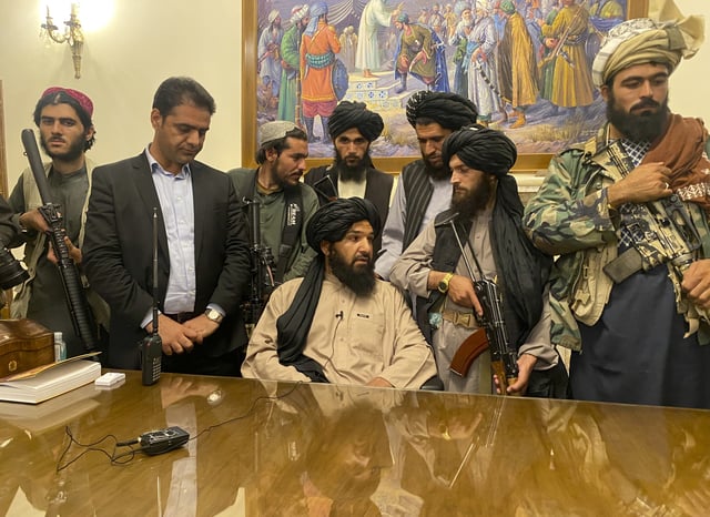 FILE - Taliban fighters take control of Afghan presidential palace after the Afghan President Ashraf Ghani fled the country, in Kabul, Afghanistan, Sunday, Aug. 15, 2021. (AP Photo/Zabi Karimi, File)