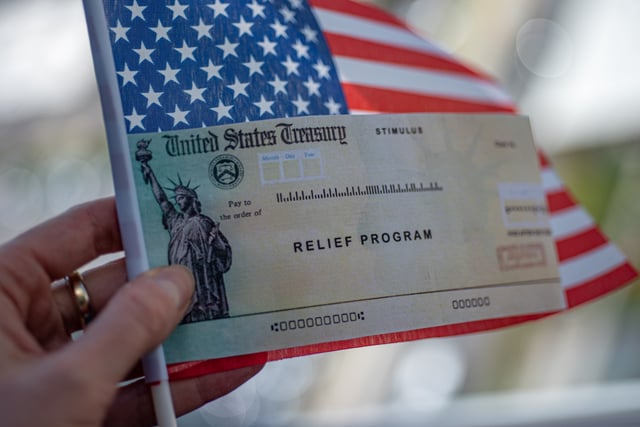 Stock image/file photo: A mock up stimulus check with an American flag.