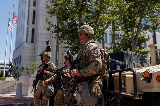 Members of the California National Guard are deployed outside a complex of federal buildings in Santa Ana, California, U.S. June, 18, 2025.  REUTERS/Mike Blake/File Photo