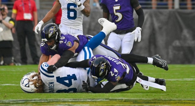 Ravens #40, Teddye Buchanan tackles Cots # 84, Tyler Warren, in the first quarter of a preseason game at M&amp;T Bank Stadium. (Kenneth K. Lam/Staff)