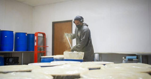 A worker shifts a barrel of Kratom inside the 1836 Kratom warehouse and headquarters Friday, Aug. 8, 2025 in Pflugerville, TX. Kratom is shipped to the United States as a crushed powder and is distributed by 1836 Kratom into various consumption forms.