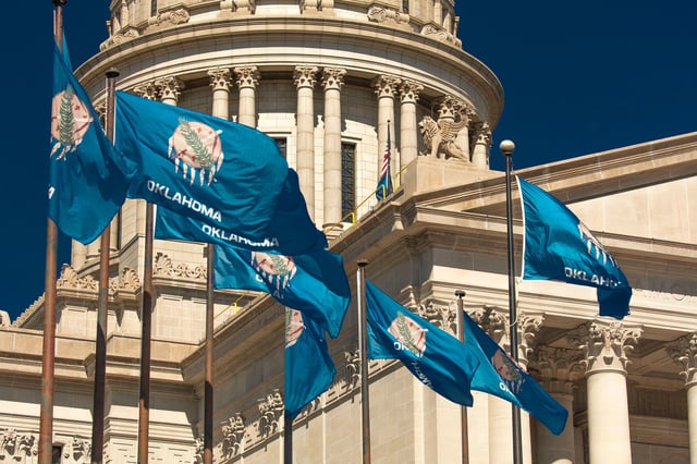 State flags fly over the Oklahoma State Capitol in Oklahoma City, Oklahoma.