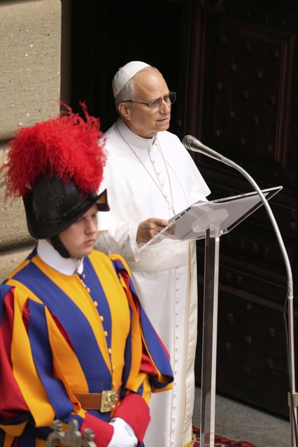 Pope Leo XIV delivers the Angelus prayer, in Castel Gandolfo, in the outskirts of Rome, Friday, Aug.15, 2025. (AP Photo/Gregorio Borgia)