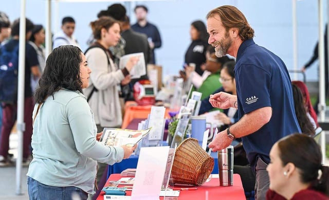 Vendors speak to job applicants during an annual job fair at Madera Community College on Tuesday, March 4, 2025. (CRAIG KOHLRUSS/Fresno Bee/TNS)