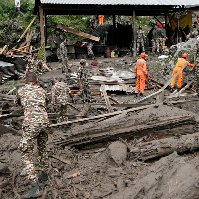 India's National Disaster Response Force (NDRF) and other security personnel carry out a rescue operation after Thursday's flash floods in Chositi village, Kishtwar district, Indian-controlled Kashmir, Friday, Aug. 15, 2025. (AP Photo/Channi Anand)