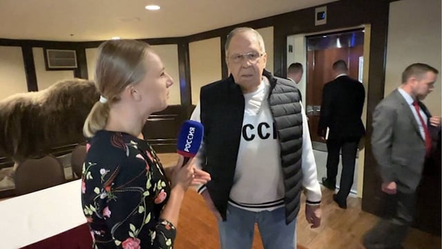 Russia's Lavrov Arrives In 'USSR' Shirt In Alaska: Soviet Unity Message For Trump? | WATCH