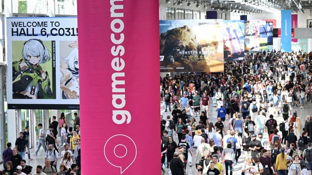 A photo shows visitors at the Gamescom video games trade fair in Cologne, western Germany on August 22, 2024.