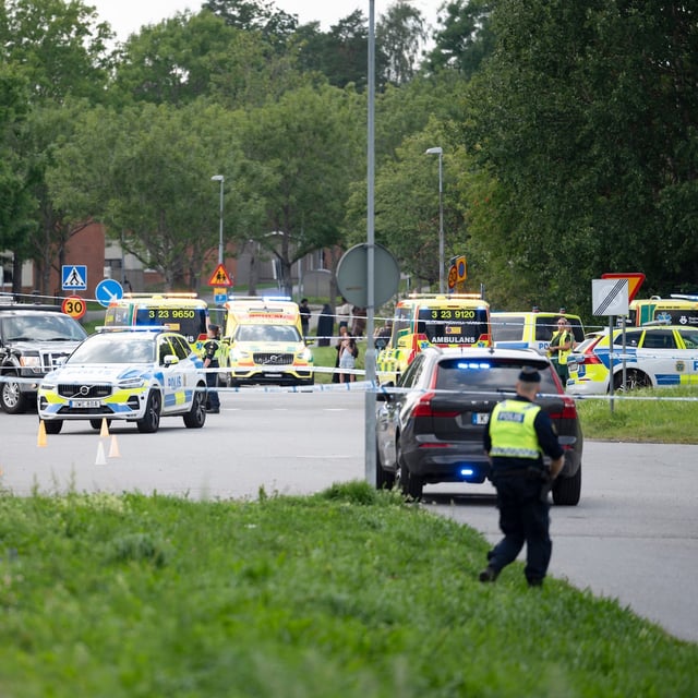 Police on scene outside a mosque after a shooting in Orebro, Sweden, Friday, Aug. 15, 2025. (Filip Gronroos/TT via AP)