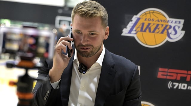 Lakers Luka Doncic (77) is interviewed by ESPN LA radio following a press conference announcing the signing of a 3-year, $165 million contract extension at UCLA Health Training Center