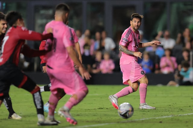 Jul 30, 2025; Ft. Lauderdale, Florida, USA; Inter Miami CF forward Lionel Messi (10) assists defender Marcelo Weigandt (57) against Atlas FC during the second half of a group stage Leagues Cup match at Chase Stadium. Mandatory Credit: Sam Navarro-Imagn Images/File Photo