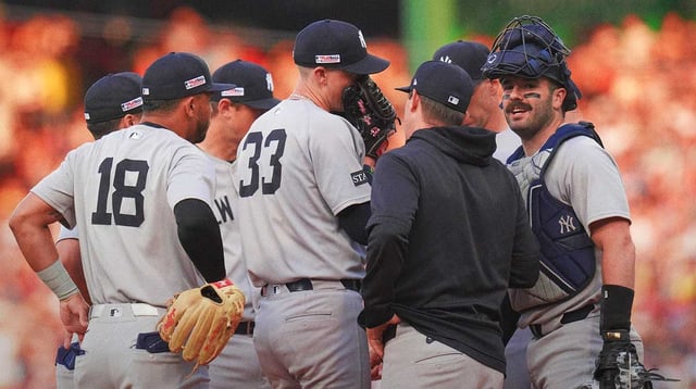 Jun 13, 2025; Boston, Massachusetts, USA; New York Yankees pitcher Ryan Yarbrough (33) talks with pitching coach Matt Blake (77) and teammates as they take on the Boston Red Sox in the first inning at Fenway Park. Mandatory Credit: David Butler II-Imagn Images