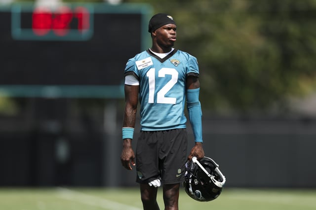 Travis Hunter #12 of the Jacksonville Jaguars looks on during a NFL Organized Team Activities (OTAs) offseason practice at Miller Electric Center on June 2, 2025 in Jacksonville, Florida.