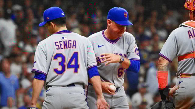 Aug 8, 2025; Milwaukee, Wisconsin, USA; New York Mets manager Carlos Mendoza takes the ball from starting pitcher Kodai Senga (34) during a pitching change in the fifth inning against the Milwaukee Brewers at American Family Field. Mandatory Credit: Benny Sieu-Imagn Images