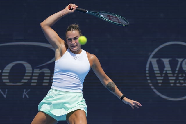 Aug 15, 2025; Cincinnati, OH, USA;  Aryna Sabalenka (BLR) returns a shot against Elena Rybakina (KAZ) during the Cincinnati Open at the Lindner Family Tennis Center. Mandatory Credit: Aaron Doster-Imagn Images