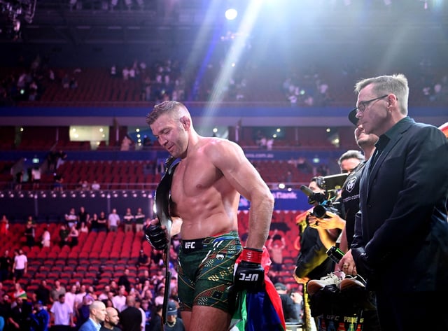 MMA - UFC 312 - Dricus Du Plessis v Sean Strickland - UFC Middleweight Title - Qudos Bank Arena, Sydney Olympic Park, Sydney, Australia - February 9, 2025 Dricus Du Plessis celebrates with the belt and the flag of South Africa after defending his UFC Middleweight Title against Sean Strickland REUTERS/Jeremy Piper/File Photo