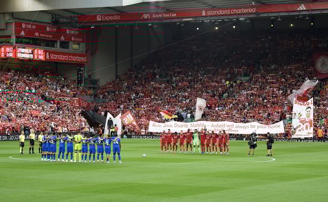 Soccer Football - Premier League - Liverpool v AFC Bournemouth - Anfield, Liverpool, Britain - August 15, 2025 The teams stand for a minutes silence in tribute to Liverpool's Diogo Jota and his brother Andre Silva before the match REUTERS/Peter Powell