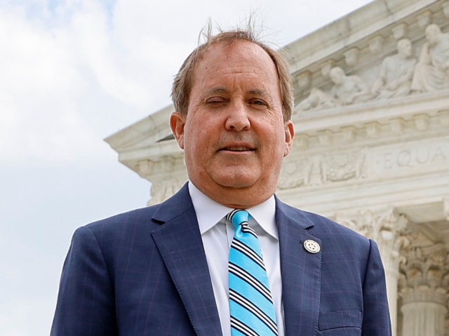 Texas Attorney General Ken Paxton (C), Texas Solicitor General Judd E. Stone and Missouri Attorney General Eric Schmitt walk out of the U.S. Supreme Court after arguments in their case about Title 42 on April 26, 2022 in Washington, DC. Paxton and Schmitt, who is running for the U.S. Senate in Missouri, are suing to challenge the the Biden Administration's repeal of the Trump Migrant Protection Protocols—aka “Remain in Mexico.” (Chip Somodevilla/Getty)