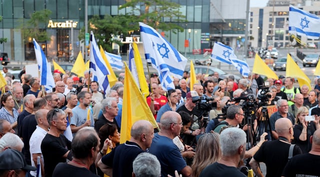 Retired and reserve Israeli Air Force pilots attend a rally calling for an immediate end to the war and urgent action to repatriate the hostages captive in Gaza since October 2023, on August 12, 2025, outside the Israeli Army headquarters in Tel Aviv. (Jack GUEZ / AFP)