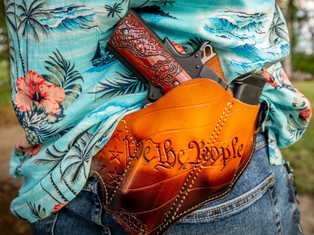 Eatonville, Washington, USA - July 4th, 2020- Matt Marshall, a member of the Eatonville school board in Washington state, at a fund raiser and 4th of July BBQ in Eatonville. Here Marshall open carries a hand gun in a "We the People" holster. (Stuart Isett/The Washington Post via Getty)