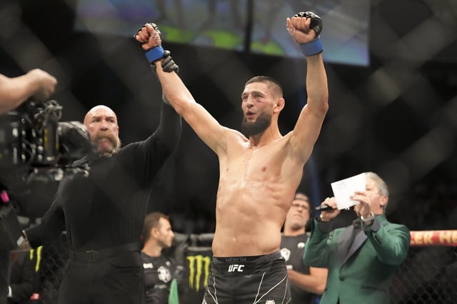 Apr 9, 2022; Jacksonville, Florida, USA;  Khamzat Chimaev (blue gloves) declared winner after a fight against Gilbert Burns (red gloves) during UFC 273 at VyStar Veterans Memorial Arena. Mandatory Credit: David Yeazell-USA TODAY Sports/File Photo