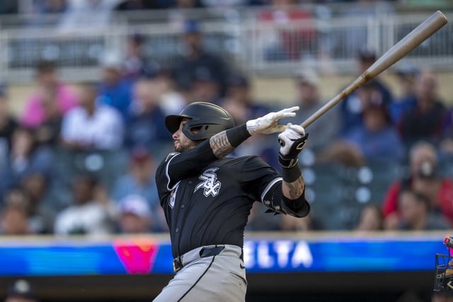 Apr 22, 2025; Minneapolis, Minnesota, USA; Chicago White Sox shortstop Jacob Amaya (8) hits a RBI sacrifice fly against the Minnesota Twins in the second inning at Target Field. Mandatory Credit: Jesse Johnson-Imagn Images/File Photo