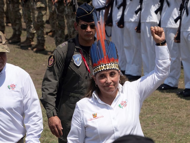 Peru's President Dina Boluarte reviews troops during a visit to Santa Rosa, Peru, an island on the Amazon River at the triple border with Colombia and Brazil, amid a territorial dispute with Colombia, Friday, Aug. 15, 2025. (AP Photo/Daniel Padilla)