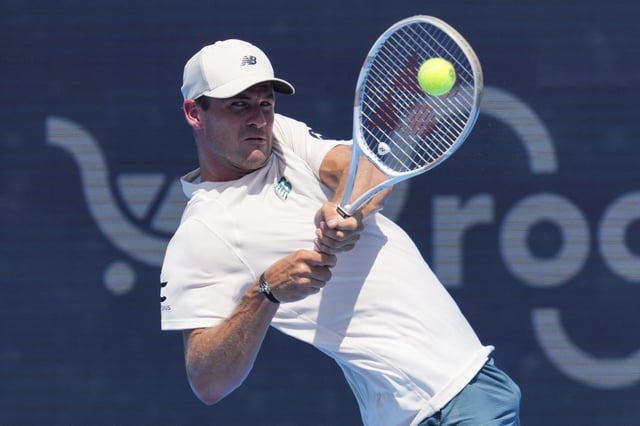 Aug 9, 2025; Cincinnati, OH, USA; Tommy Paul (USA) returns a shot against Pedro Martinez (ESP) during the Cincinnati Open at the Lindner Family Tennis Center. Mandatory Credit: Aaron Doster-Imagn Images