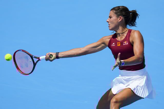 Aug 10, 2025; Cincinnati, OH, USA;  Emma Navarro (USA) returns a shot against Ella Seidel (GER) during the Cincinnati Open at the Lindner Family Tennis Center. Mandatory Credit: Aaron Doster-Imagn Images