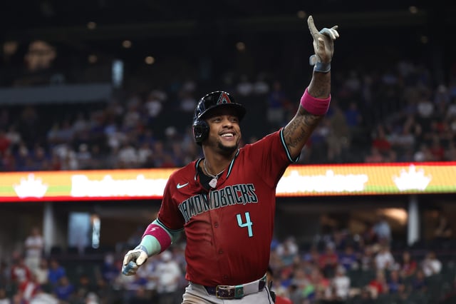 ARLINGTON, TEXAS - AUGUST 13: Ketel Marte #4 of the Arizona Diamondbacks gestures to the crowd after hitting a three-run home run in the ninth inning against the Texas Rangers at Globe Life Field on August 13, 2025 in Arlington, Texas.