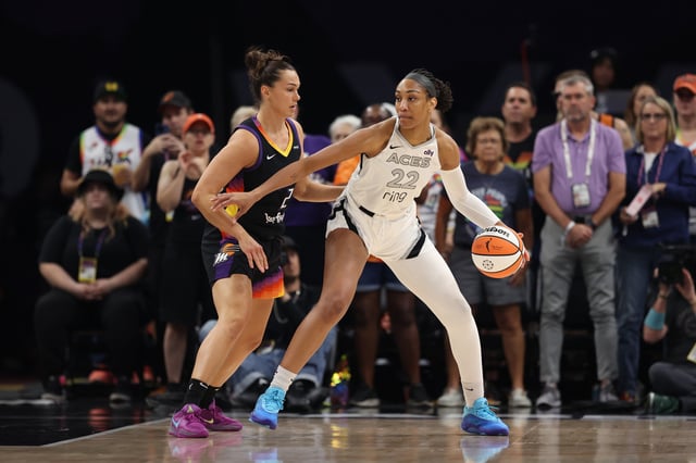 A&#39;ja Wilson #22 of the Las Vegas Aces dribbles the ball while guarded by Kahleah Copper #2 of the Phoenix Mercury during the first half of the WNBA game at PHX Arena on June 29, 2025 in Phoenix, Arizona.