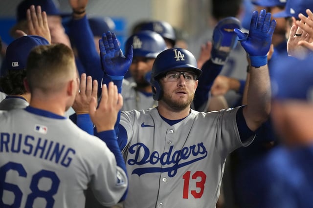 Aug 11, 2025; Anaheim, California, USA; Los Angeles Dodgers third baseman Max Muncy (13) celebrates with teammates after hitting a three-run home run in the eighth inning against the Los Angeles Angels at Angel Stadium. Kirby Lee-Imagn Images/ File Photo