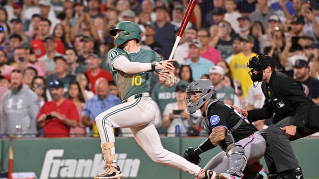 Aug 15, 2025; Boston, Massachusetts, USA; Boston Red Sox shortstop Trevor Story (10) hits a walk-off RBI against the Miami Marlins during the ninth inning at Fenway Park. Mandatory Credit: Eric Canha-Imagn Images