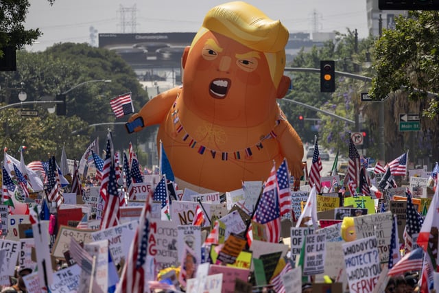 People march during a "No Kings" movement protest on June 14, 2025 in Los Angeles, Calif.