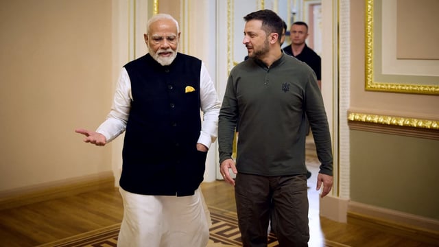 This handout photograph taken and released by the Ukrainian Presidential Press Service on August 23, 2024, shows Ukraine's President Volodymyr Zelensky (R) speaking with Indian Prime Minister Narendra Modi at the Mariinskyi Palace ahead of their meeting, in Kyiv.