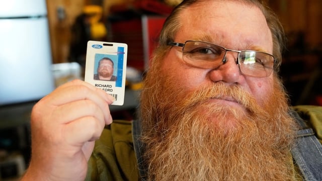 Richard Guilford poses for a portrait with an ID card from his recently recovered wallet that he lost 11 years ago Thursday, Aug. 14, 2025, in Petersburg, Mich. 