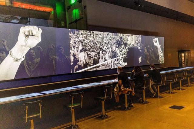 An exhibit of a segregated lunch counter displays videos from the civil rights movement at the Smithsonian National Museum of African American History and Culture,  on April 4.