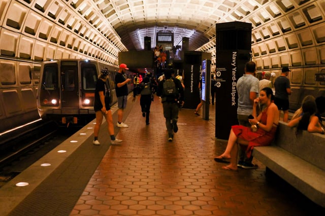 Members of the FBI and the Diplomatic Security Service (DSS) run at the Navy Yard–Ballpark metro station in Navy Yard in Washington, D.C., U.S., August 15, 2025. REUTERS/Jose Luis Gonzalez/File Photo