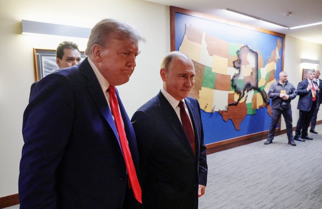 U.S. President Donald Trump and Russian President Vladimir Putin walk to a joint news conference following their meeting at Joint Base Elmendorf-Richardson in Anchorage, Alaska, U.S., August 15, 2025. Sputnik/Gavriil Grigorov/Pool via REUTERS/File Photo