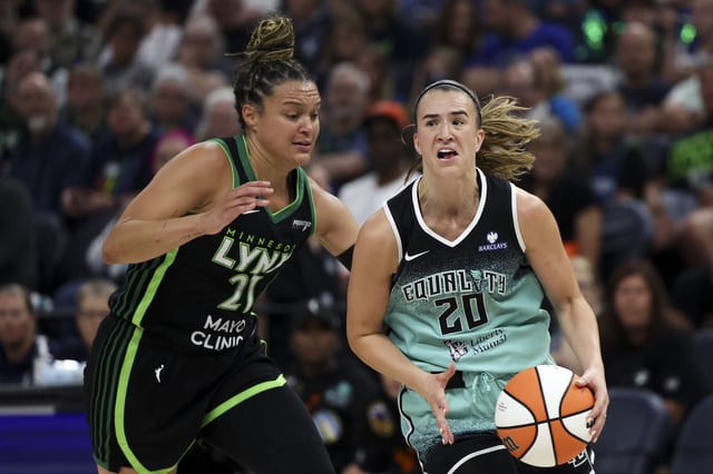 Sabrina Ionescu #20 of the New York Liberty drives toward the hoop against Kayla McBride #21 of the Minnesota Lynx in the third quarter at Target Center on July 30, 2025 in Minneapolis, Minnesota.