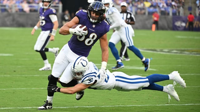 Aug 7, 2025; Baltimore, Maryland, USA; Baltimore Ravens tight end Charlie Kolar (88) is tackled by Indianapolis Colts safety Hunter Wohler (30) during the first quarter at M&amp;T Bank Stadium. Mandatory Credit: Rafael Suanes-Imagn Images
