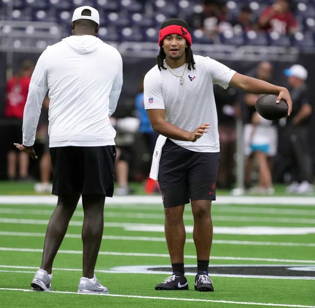 Houston Texans quarterback C.J. Stroud warms up during the first half of a pre-season NFL football game at NRG Stadium in Houston, Saturday, Aug. 16, 2025.
