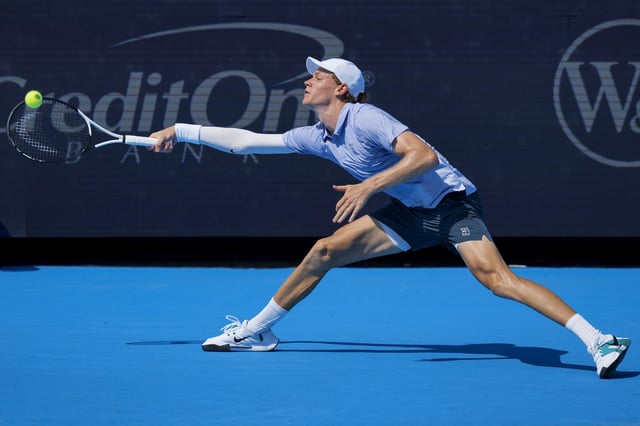 Aug 16, 2025; Cincinnati, OH, USA;  Jannik Sinner (ITA) returns a shot against Terence Atmane (FRA) during the Cincinnati Open at the Lindner Family Tennis Center. Mandatory Credit: Aaron Doster-Imagn Images