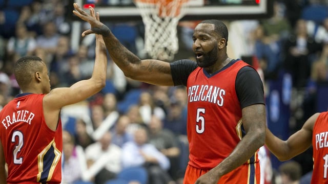 Pelicans center Kendrick Perkins (5) high fives New Orleans Pelicans guard Tim Frazier (2) after making a buzzer beater shot at the end of third quarter against the Minnesota Timberwolves at Target Center. The Timberwolves won 144-109