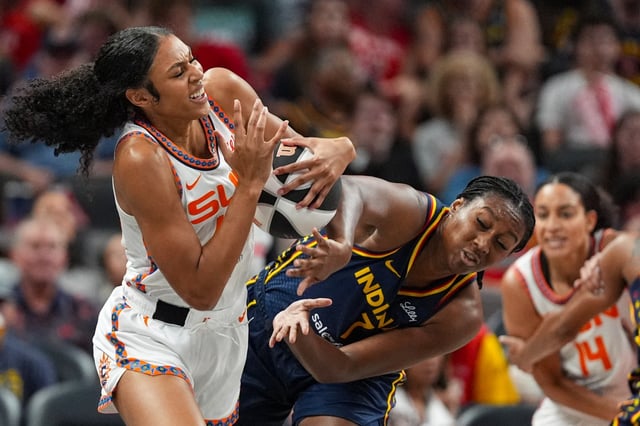 Indiana Fever forward Aliyah Boston (7) defends Connecticut Sun forward Olivia Nelson-Ododa (10) in the second half of a WNBA basketball game in Indianapolis, Tuesday, June 17, 2025. (AP Photo/Michael Conroy)